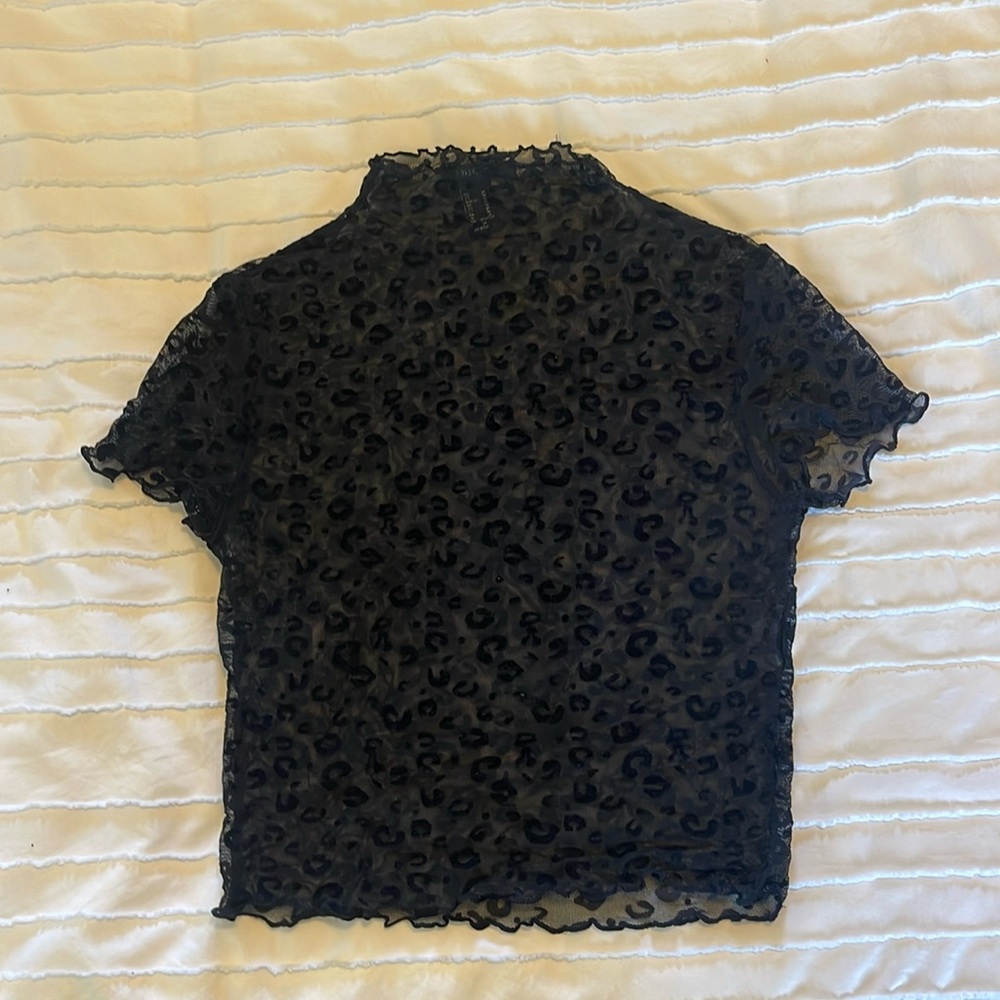 Slightly worn forever 21 black leopard print top, size medium.